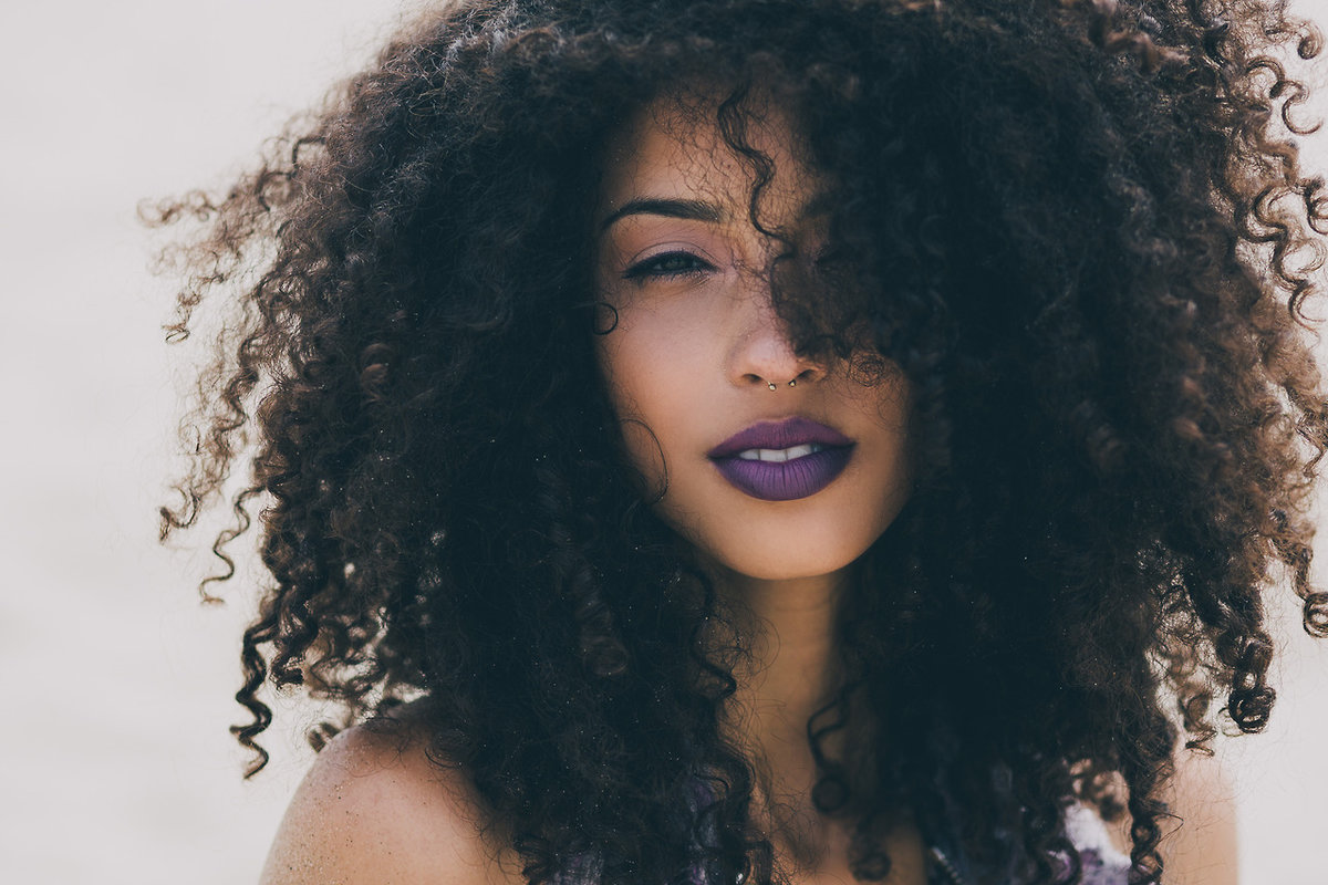 Light skinned black girl with curly hair