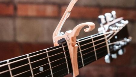 Каподастр для гитары: назначение и особенности выбора