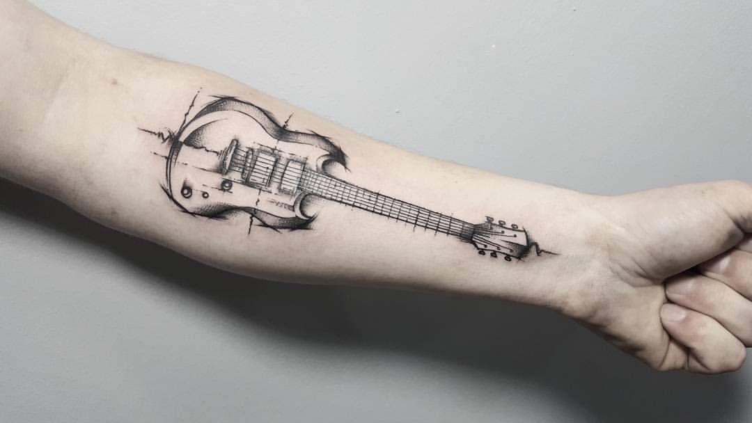 Значение и эскизы тату в виде гитары.